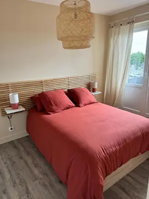 Un ou plusieurs lits dans un hébergement de l'établissement Appartement charmant