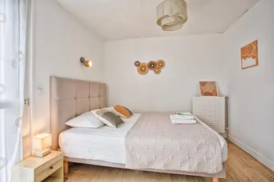 Un ou plusieurs lits dans un hébergement de l'établissement Appartement 