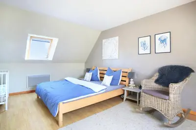 Un ou plusieurs lits dans un hébergement de l'établissement La Maison Merlin - Maison avec piscine Sénoville
