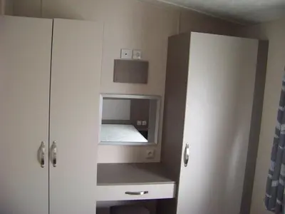 Cuisine ou kitchenette dans l'établissement Mobil home Céleste 6-8 personnes