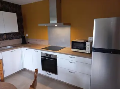Cuisine ou kitchenette dans l'établissement La Tourelle