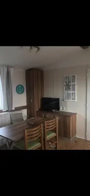 Télévision ou salle de divertissement dans l'établissement Mobil home
