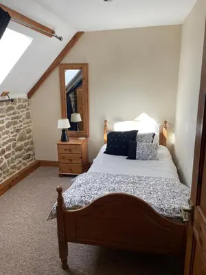 Un ou plusieurs lits dans un hébergement de l'établissement Rustic and spacious converted Barn