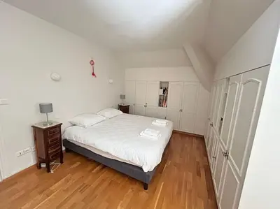 Un ou plusieurs lits dans un hébergement de l'établissement Duplex familial et confortable proche Zénith