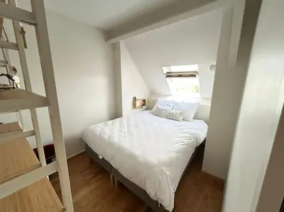 Un ou plusieurs lits dans un hébergement de l'établissement Duplex familial et confortable proche Zénith