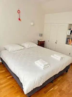 Un ou plusieurs lits dans un hébergement de l'établissement Duplex familial et confortable proche Zénith