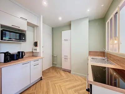 Cuisine ou kitchenette dans l'établissement Au cœur du centre historique