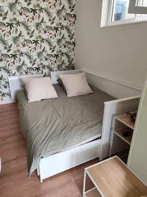 Un ou plusieurs lits dans un hébergement de l'établissement Studio de la seine