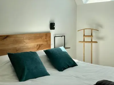 Un ou plusieurs lits dans un hébergement de l'établissement Le Logis Courtelay by Melrose