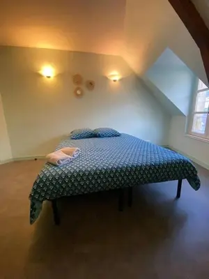Un ou plusieurs lits dans un hébergement de l'établissement Studio charmant à Cherbourg-en-Cotentin - 20m² - Parking