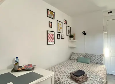 Un ou plusieurs lits dans un hébergement de l'établissement Studio Rue Saint Jean