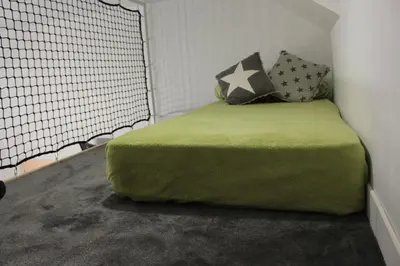 Un ou plusieurs lits dans un hébergement de l'établissement Chambre d'hôtes vue sur mer