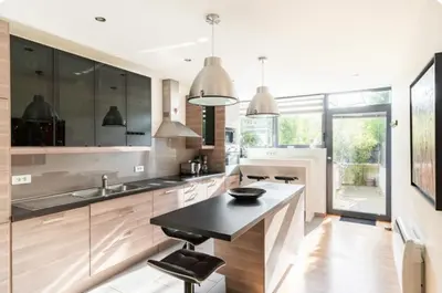 Télévision ou salle de divertissement dans l'établissement Maison Caen