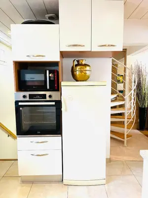 Cuisine ou kitchenette dans l'établissement les pieds dans l'eau