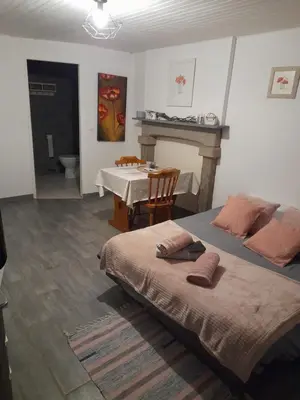 Un ou plusieurs lits dans un hébergement de l'établissement Domaine de la Tour carrée - 3 Chambres