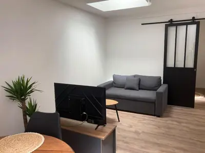 Coin salon dans l'établissement Maison 2 pièces Ouistreham