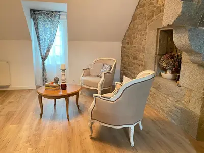 Coin salon dans l'établissement Les gites Romeline