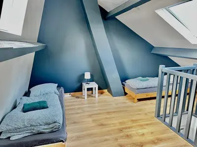 Un ou plusieurs lits dans un hébergement de l'établissement La Casita, triplex avec jardin proche du centre