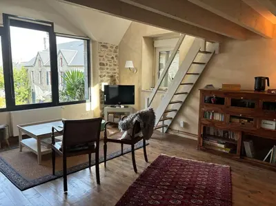 Coin salon dans l'établissement Les Palmiers