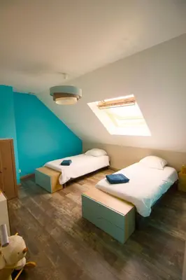 Un ou plusieurs lits dans un hébergement de l'établissement Evasion entre Mer et Campagne avec Babyfoot et terrain de pétanque, 3 chambres, cheminée - Intendance Luxury Host
