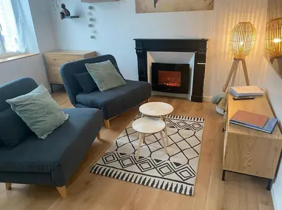 Coin salon dans l'établissement Superbe appartement proche mont saint michel