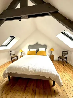Un ou plusieurs lits dans un hébergement de l'établissement Duplex de charme à Valognes