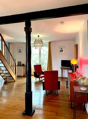 Coin salon dans l'établissement Duplex de charme à Valognes