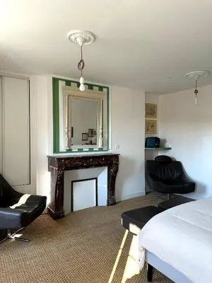 Coin salon dans l'établissement Chambre d'hôtes de charme Partager Enregistrer