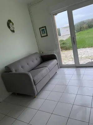 Coin salon dans l'établissement Appartement RDC avec terrasse