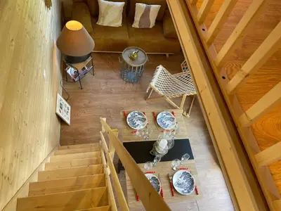 Coin salon dans l'établissement Chalet charmant à Sainte-Marie-du-Mont avec terrasse