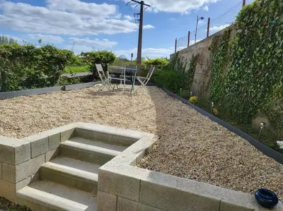 Jardin de l'établissement Charmante maison