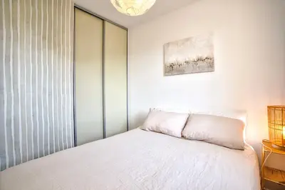 Un ou plusieurs lits dans un hébergement de l'établissement Appt cosy Cabourg 2 min plage 5 min thalasso