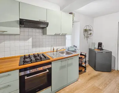 Cuisine ou kitchenette dans l'établissement Le SweetHome
