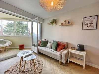 Coin salon dans l'établissement Appartement bohémien à Cabourg