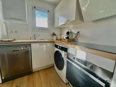 Cuisine ou kitchenette dans l'établissement L'îleau, accès direct plage et jardin