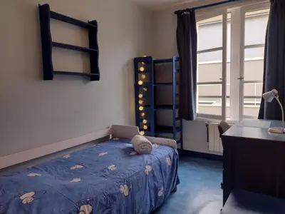 Un ou plusieurs lits dans un hébergement de l'établissement Petit appartement - Quartier Vaugueux Château