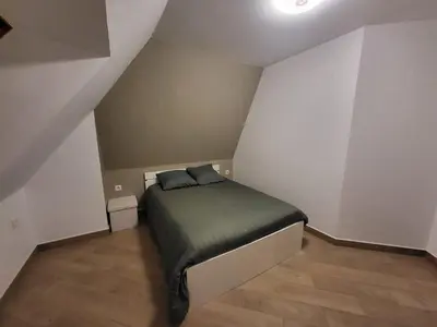 Un ou plusieurs lits dans un hébergement de l'établissement Appartement