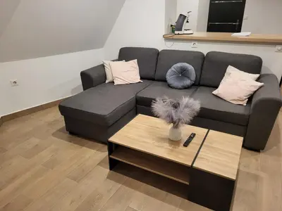 Coin salon dans l'établissement Appartement