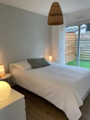 Un ou plusieurs lits dans un hébergement de l'établissement Petite maison cosy