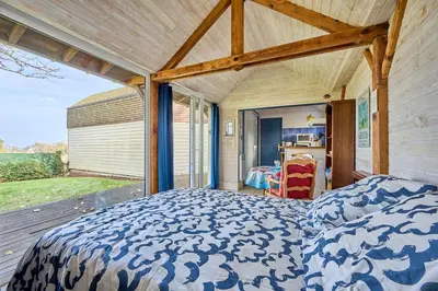 Un ou plusieurs lits dans un hébergement de l'établissement The Tiny House - maisonette proche de la plage