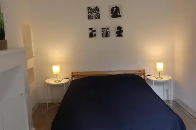 Un ou plusieurs lits dans un hébergement de l'établissement Charme et confort dans le centre-ville de Falaise quartier calme - Larès