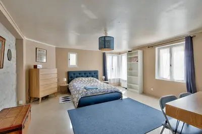 Un ou plusieurs lits dans un hébergement de l'établissement Appartement quartier Vaugueux