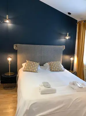 Un ou plusieurs lits dans un hébergement de l'établissement Petite Villa de impasse du Prieure