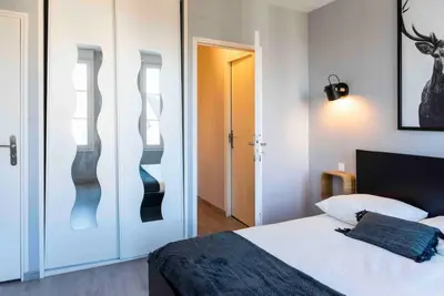 Un ou plusieurs lits dans un hébergement de l'établissement Triplex 5 personnes au calme