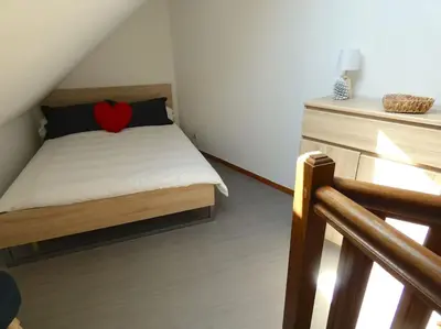 Un ou plusieurs lits dans un hébergement de l'établissement Maison en triplex au centre-ville de Cherbourg
