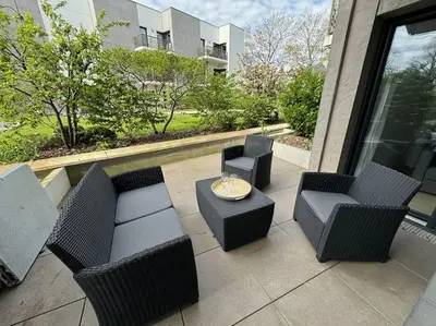 Coin salon dans l'établissement Appartement spacieux avec terrasse