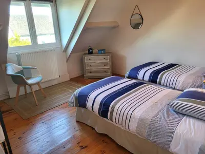 Un ou plusieurs lits dans un hébergement de l'établissement Charmante villa de bord de mer