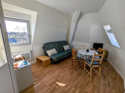 Coin salon dans l'établissement Appartement vue sur mer et accès direct à la plage