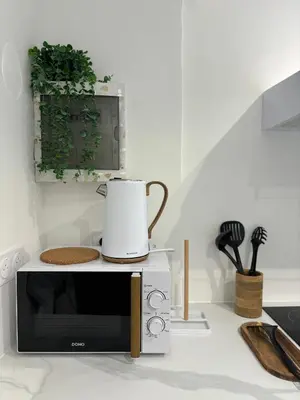 Cuisine ou kitchenette dans l'établissement Appartement terrasse au cœur de la ville