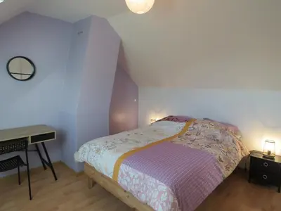 Un ou plusieurs lits dans un hébergement de l'établissement Maison calme proche mer